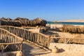 Palm sunshades and beach of Mahmya island egypt Royalty Free Stock Photo