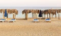 Palm thatch bed shade on the sand beach