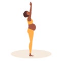 Palm Tree Pose. Pregnant African American woman doing yoga. Woman in sportswear doing exercises on mat. Women healthy Royalty Free Stock Photo