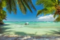Palm trees and a boat on luxury exotic carribean beach Royalty Free Stock Photo