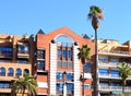 Palm trees facade of a residential building. Facade building with Palm trees. Royalty Free Stock Photo