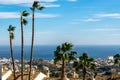 Palm trees on a hilltop overlooking the Mediterranean Sea in Benalmadena, Spain. Royalty Free Stock Photo