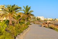 Palm trees and hotel buildings along coastal promenade Royalty Free Stock Photo