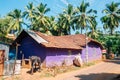 Tropical palm trees and purple house in Palolem beach, Goa, India Royalty Free Stock Photo