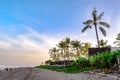 Palm trees located on the edge of the petitenget beach in Bali, Indonesia, are very charming with the warmth of the sun