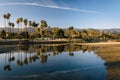 Palm trees reflecting in Mission Creek, in Santa Barbara, Califo