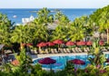 Palm trees and swimming pool in hotel in south Turkey Royalty Free Stock Photo