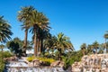 Palm trees, Waterfall and pond, Exotic island under a cloudless blue sky Royalty Free Stock Photo