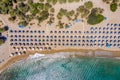 Palm Vai Beach, Crete, Greece - beautiful drone aerial view of palm forest, blue water, sky and sun shelters