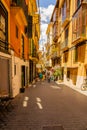 Vintage cozy narrow streets of palma de mallorca in the sommer with many tourists