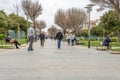 People wearing face masks strolling through the Parque de las Estaciones