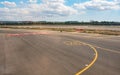 Palma, Spain - September 25, 2019: Yellow direction lines on ground of Mallorca airport, sun shines to empty runways near