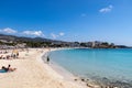 Palmanova, Mallorca, Spain - April 13, 2019: tourists taking a sunbath on the beach Platja de Palmanova, Mediterranean Sea,
