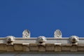 Palmette antefix ornaments and lion head water spouts