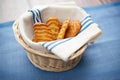 palmiers in a wicker basket with a blue linen napkin