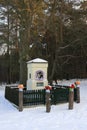 Palmiry, Mazovia, Poland - Traditional roadside shrine in the Kampinoski National Park forest in winter season