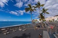 Palms  at beach with black lava sand at Puerto Naos in La Palma Island, Canary Island, Spain Royalty Free Stock Photo