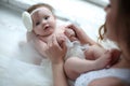 Small hands of a newborn baby in the tender palms of a caring mother Royalty Free Stock Photo