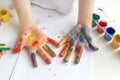 Palms painted on childrens hands with multi-colored paints. Childs hobby creativity and art. Children Protection Day. Happy Royalty Free Stock Photo