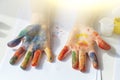 Palms painted on childrens hands with multi-colored paints. Childs hobby creativity and art. Children Protection Day. Happy Royalty Free Stock Photo