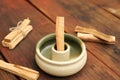 Palo Santo sticks and holder on wooden table