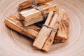 Palo Santo tree sticks in wooden bowl - holy incense tree from Latin America. Meditation, mental health and personal