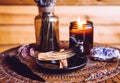 Palo Santo wood known as oily aromatic holy wood sticks smouldering on plate in home living room cleansing negative energy concept