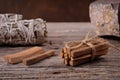 Palo santo wood sticks and white sage bundle on the wooden background Royalty Free Stock Photo