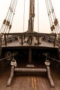 View of the foredeck of the historic Pinta sailing ship with traditional rope rigging and wooden mast