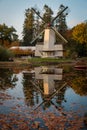 Dutch paltrok windmill with reflection in the water Royalty Free Stock Photo