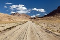 Pamir highway Pamirskij trakt with biker, there is one of the best cycling road on the world. Unpaved road in Tajikistan, roof