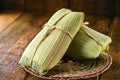 Pamonha, typical corn sweet with rural cheese from Brazil, closed in dry straw, consumed in July and June parties Royalty Free Stock Photo