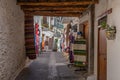 PAMPANEIRA, SPAIN, JUNE 22, 2019: People are stolling on the main street of Pampaneira in Spain Royalty Free Stock Photo