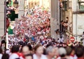 PAMPLONA, SPAIN -JULY 9: People run from bulls on street Santo D Royalty Free Stock Photo