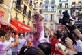 PAMPLONA, SPAIN - JULY 6: A woman watering red wine at opening o