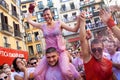 PAMPLONA, SPAIN - JULY 6: A woman watering red wine at opening o