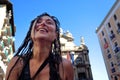 PAMPLONA, SPAIN - JULY 6: A woman watering red wine at opening o