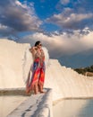 Pamukkale, Denizli, Turkey - August 26 2021: One of the touristic activities in Pamukkale: A woman with white wings posing as an