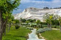 Pamukkale, Turkey. Cotton mountain with travertine terraces of geothermal springs against a blue sky