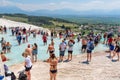 People enjoying the thermal water in terraces of carbonate minerals in Pamukkale, Turkey. Tourist attraction