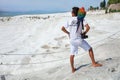 A young photographer with a large colorful parrot