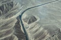 The Pan-American Highway next to a spiral geoglyph, Nazca Lines, Peru Royalty Free Stock Photo