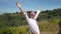 Women in blindfolds enjoying freedom in nature