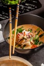 Pan-Asian cuisine concept. Japanese miso soup Tom Yam Kung with seafood, shrimps, mussels, calamari. Serving dishes Royalty Free Stock Photo