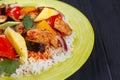 Pan-Asian food, appetizing spicy rice with chicken, pineapple sl