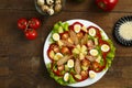 Pan-Asian salad with cherry tomatoes, smoked chicken, pineapple and sesame seeds. Royalty Free Stock Photo