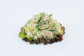 Pan Asian Sarada salad with snow crab meat, cucumber, tobiko flying fish roe and salad mix isolated on background.