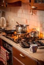 Pan boiling on burning gas stove on country style kitchen Royalty Free Stock Photo