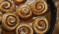 A pan of cinnamon rolls with a glaze on top Royalty Free Stock Photo