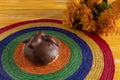 Pan de Muerto, Bread of Dead Mexican Sugar Scone and Chocolate on Woven Tablecloth.